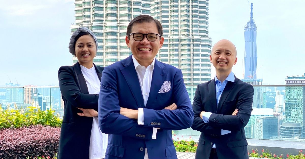 Pantas Co-founders Syaheedah, Max and Eong standing side by side with the KLCC Twin Towers in the background